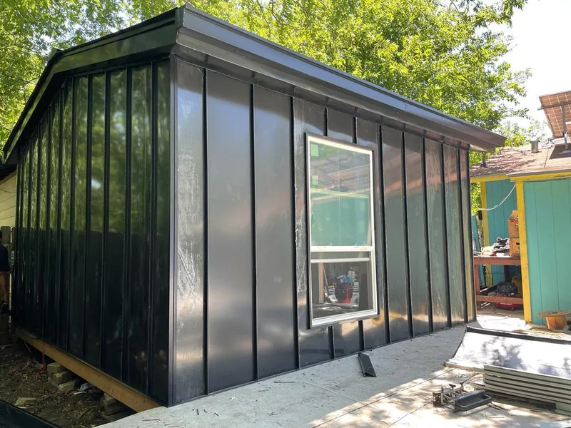 Black standing seam metal wall panels for Roof Inspection in Hallsville