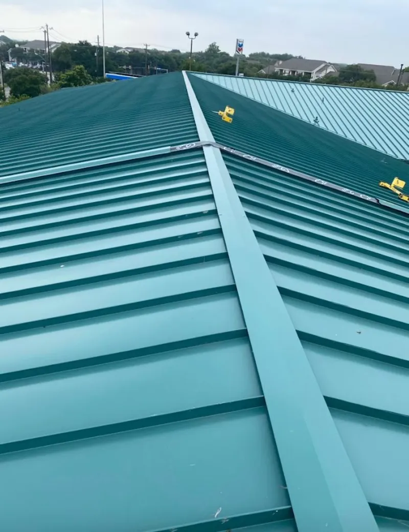 Green commercial metal roof ridge and valley for Metal Roof Repair in Hallsville