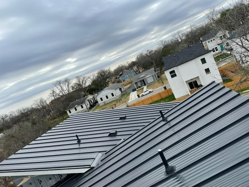 Standing seam metal roof panels with vents for Skylight Repair in Hallsville